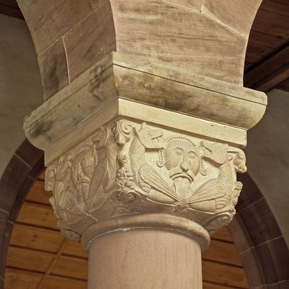 Figural cushion capital on a column in the church at Alpirsbach Monastery