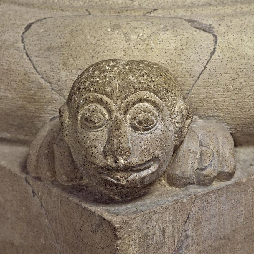 Grotesque, or mascaron, as corner decoration on a column base in the church at Alpirsbach Monastery